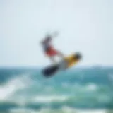 Dynamic action shot of a kiteboarder executing a jump