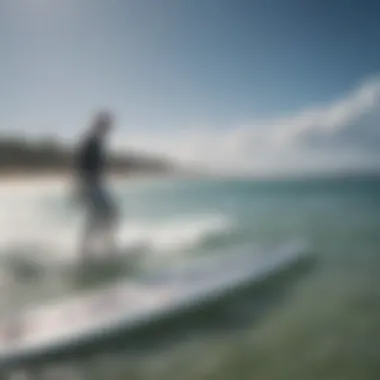 A kiteboarder inspecting a used foil board for performance