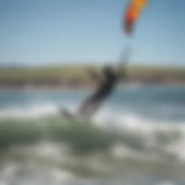 A vibrant kite soaring over the waves at Bodega Beach