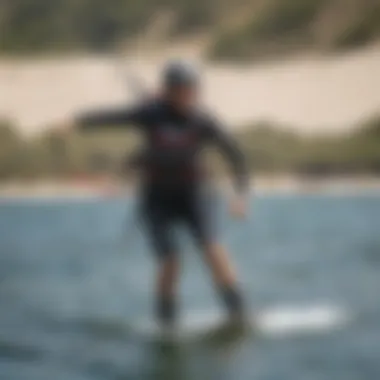 Kiteboarder demonstrating proper usage of a bungee waist leash on the water