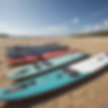 An array of kitesurfing boards displayed on a sandy beach