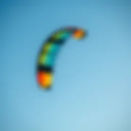 A vibrant Ozone kite soaring in a clear blue sky