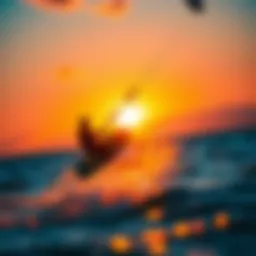 A captivating view of a kite surfer in action against a vibrant sunset.