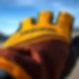 Material Quality of Dakine Gloves Close-up view of Dakine sailing gloves showcasing material texture