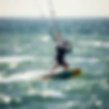 Maneuvering with Duotone Foil Wing in Ocean Conditions Kiteboarder maneuvering with a Duotone foil wing against an ocean backdrop