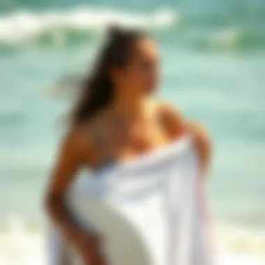 Stylish surfer using a changing towel post-surfing