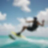 A kiteboarder gliding across the turquoise waters of Aruba