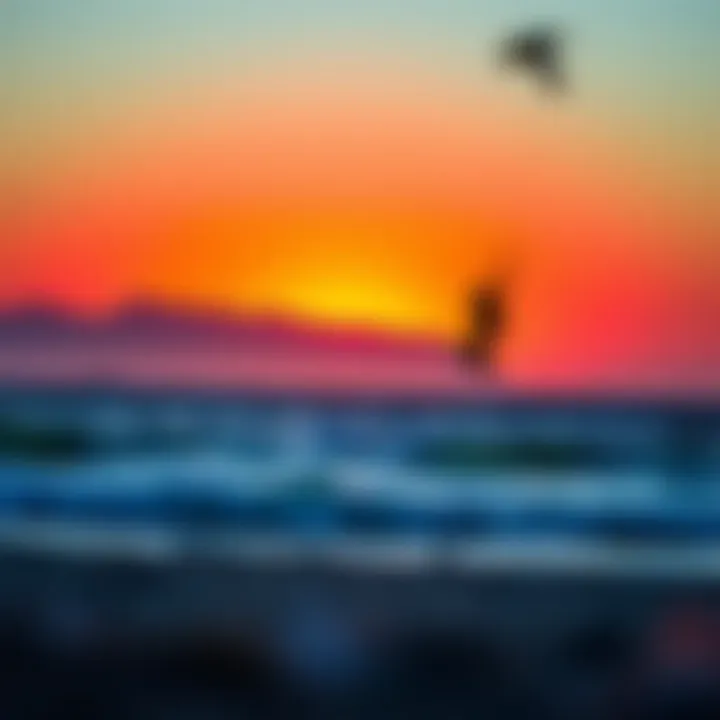 Vibrant sunset casting colors over a kiteboarding beach