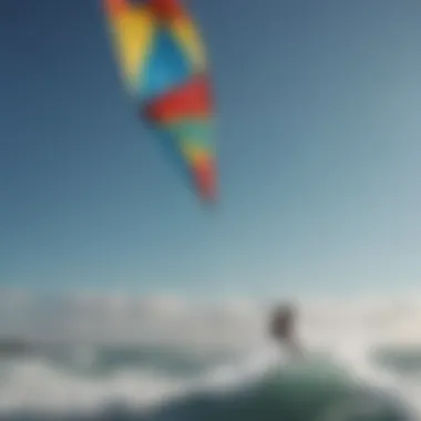 A vibrant kite soaring high above the waves