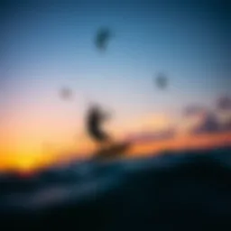A kiteboarder gracefully gliding over the water at sunset