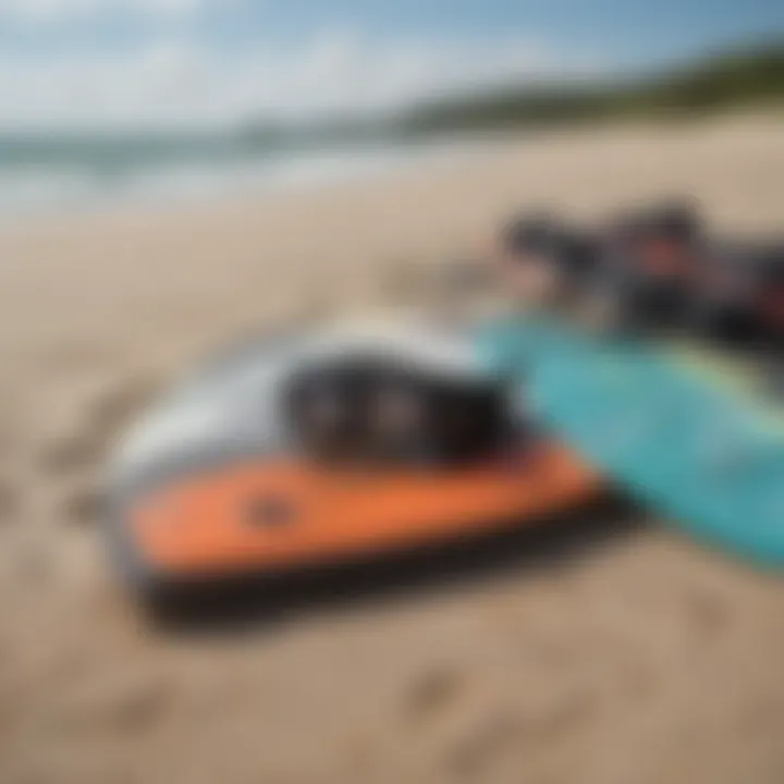 A close-up of essential kiteboarding gear laid out on the beach