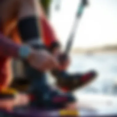 Rider Preparing with Kiteboarding Booties A rider putting on kiteboarding booties before hitting the water