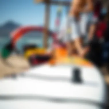 A close-up view of essential kitesurfing gear including a board and kite ready for use