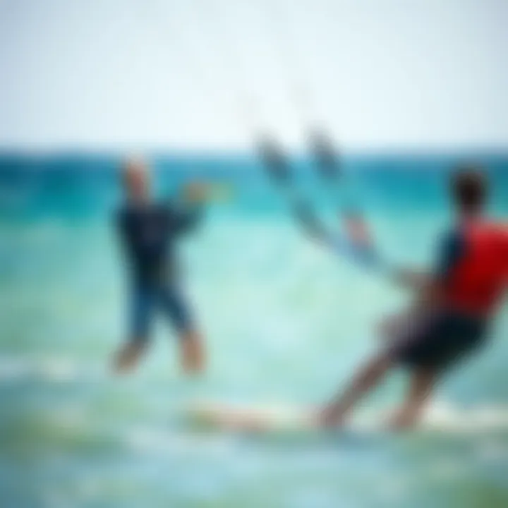An instructor demonstrating kitesurfing techniques on the water with a student