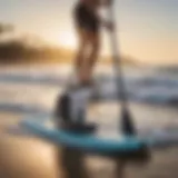 A battery-operated paddle board pump in action on the beach