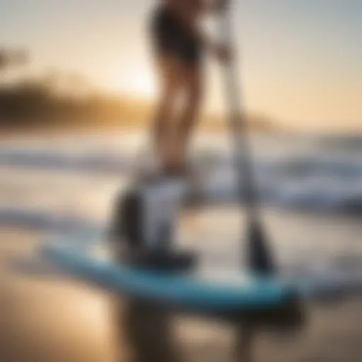 A battery-operated paddle board pump in action on the beach