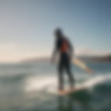 A serene coastal scene where a kiteboarder prepares for a session while inspecting the foil board, emphasizing the importance of maintenance.