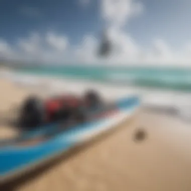 Essential kiteboarding gear arranged on sandy shore