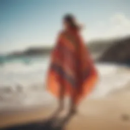 A vibrant changing poncho draped elegantly on a rocky beach