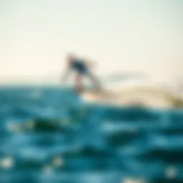 A rider gracefully glides above the water's surface on a foil board