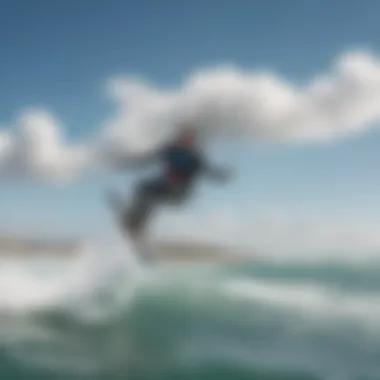 Kiteboarders riding the waves with the picturesque backdrop of Isla Blanca