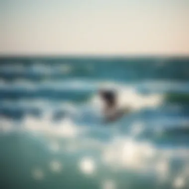 A picturesque view of a kite surfer riding the waves