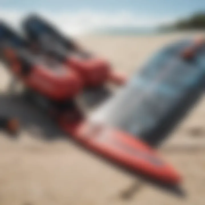 Close-up of essential kite surfing gear laid out on the beach