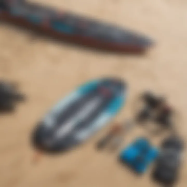 Close-up of essential kiteboarding gear laid out on the sand.