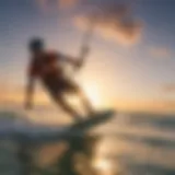 Kiteboarder riding the waves at sunset