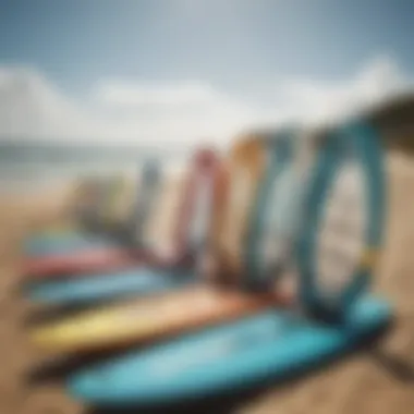 A variety of kitesurfing boards displayed on a beach