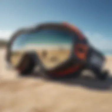 Close-up of kitesurfing goggles on a sandy beach