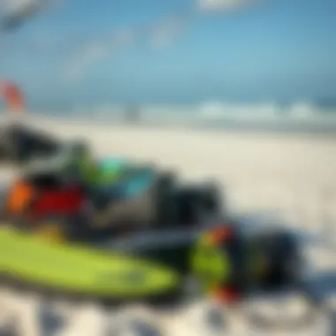 Diverse kitesurfing gear laid out on the beach