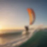 A breathtaking view of a kitesurfer gliding across the waves at sunset