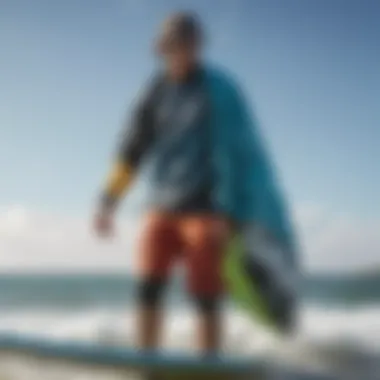 A vibrant image of the Mystic Surf Poncho displayed against a backdrop of kiteboarding equipment.