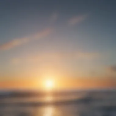 A serene ocean view at sunset with kiteboarders in the distance