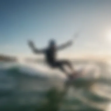 A kiteboarder practicing stunts on the waves