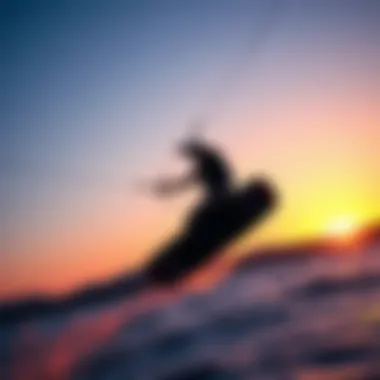 Kiteboarder at Dusk Kiteboarder catching air against a sunset backdrop