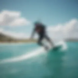 Kiteboarder gliding over clear turquoise waters