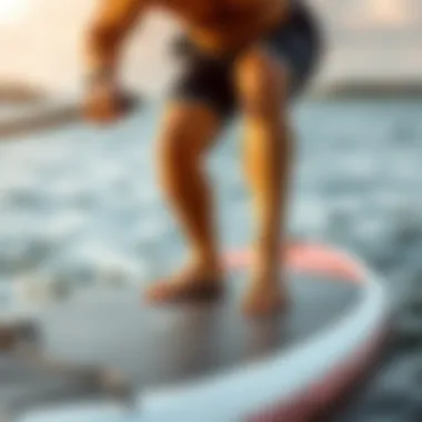 An individual performing a fitness exercise on a paddle board, demonstrating balance and strength.
