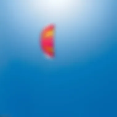 A vibrant kite soaring against a bright blue sky