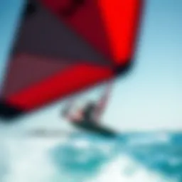 A wing surfer gliding across the water with the wind in their sail